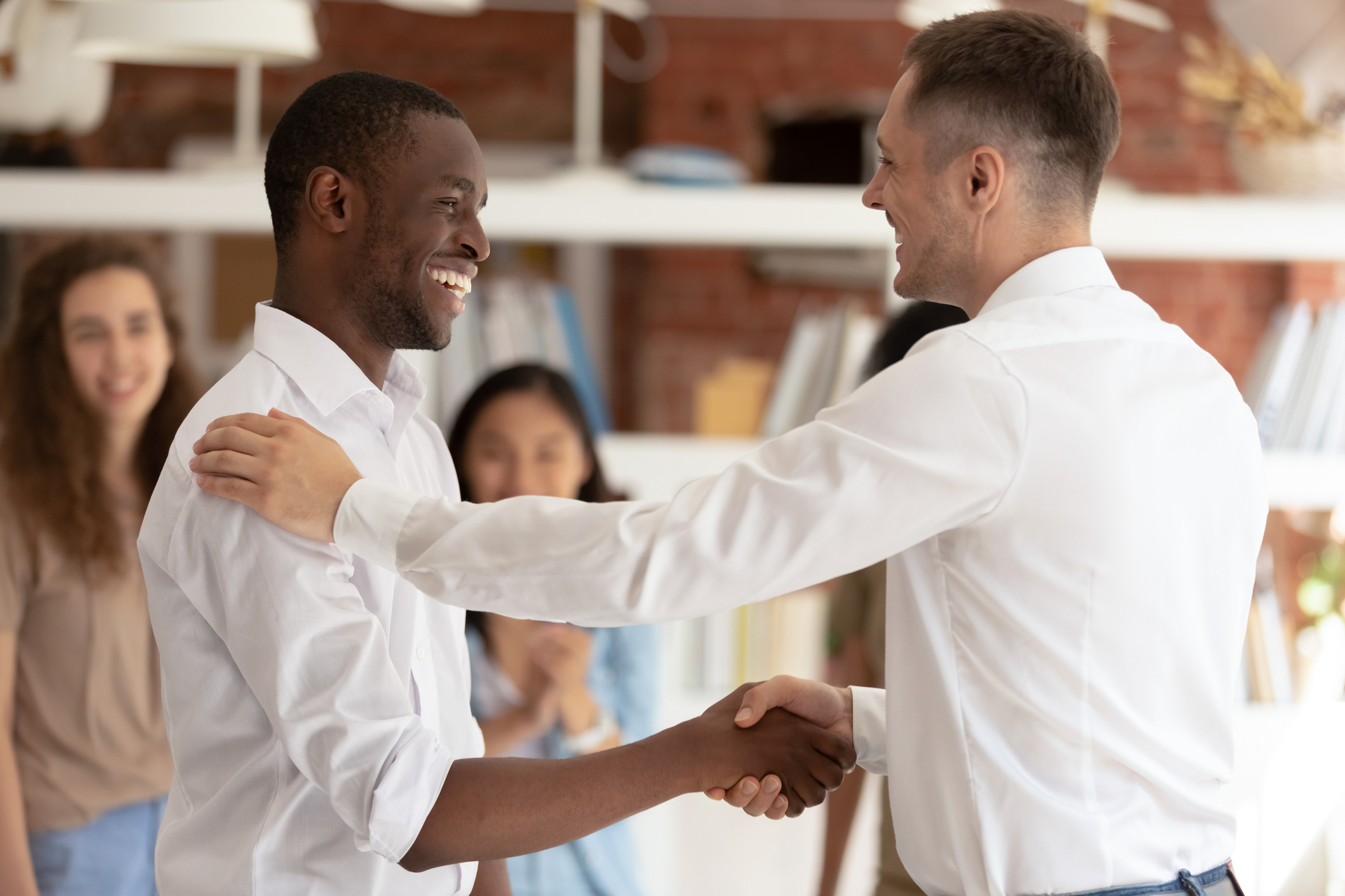 two employee shaking hands