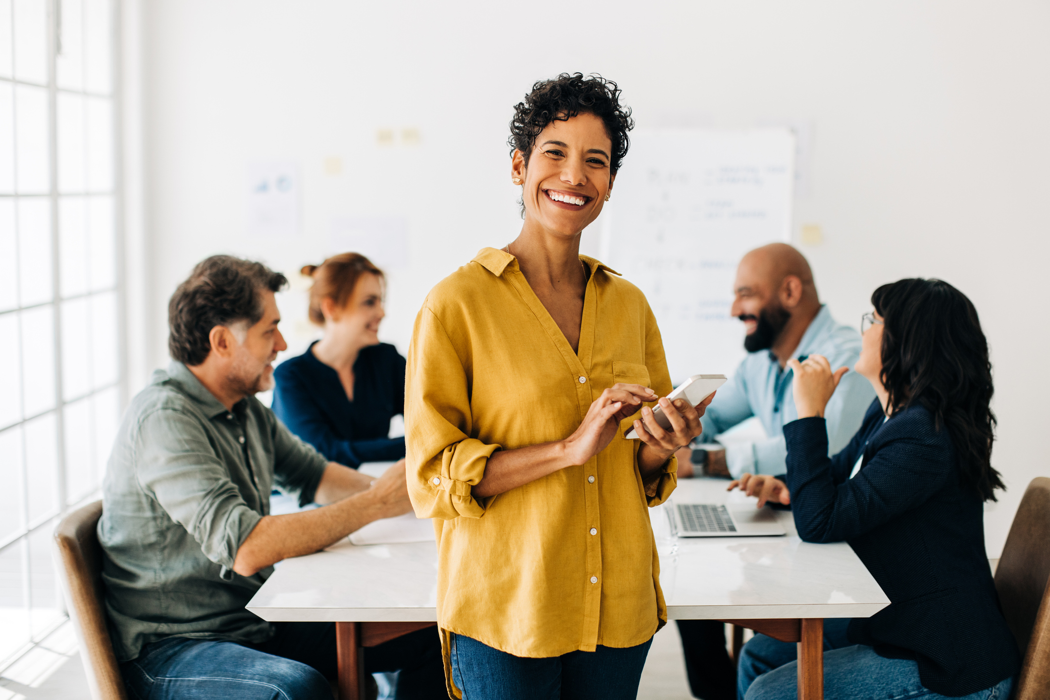 employee smiling and happy about their financial wellness