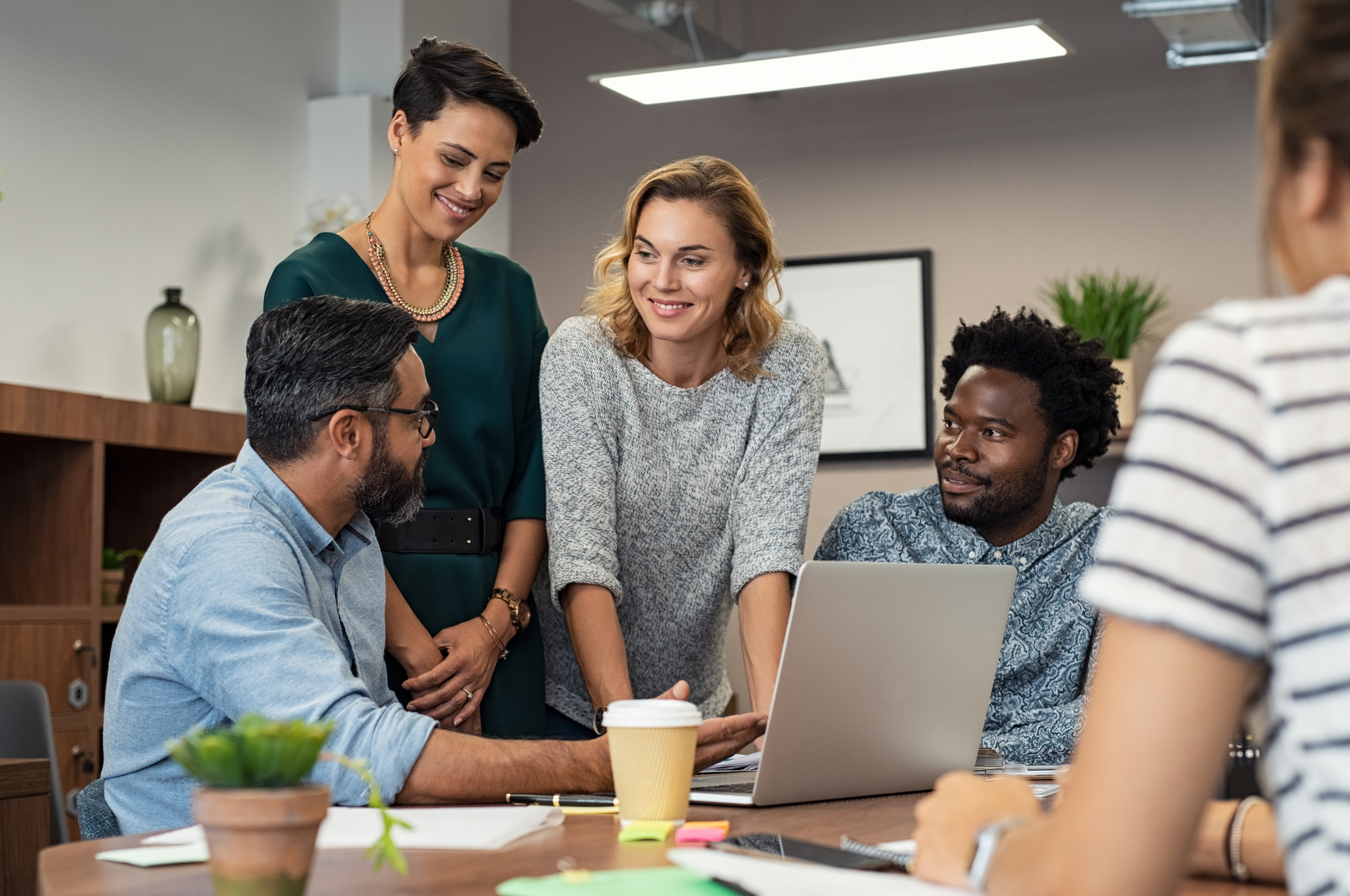 employees discussing their benefits programs