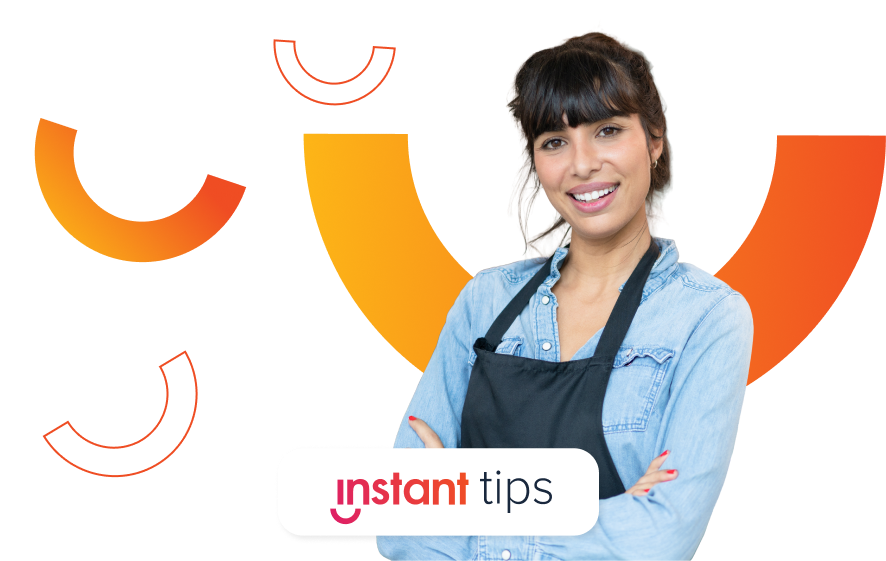 young female restaurant employee looking happy with her arms crossed