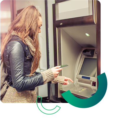 woman making withdrawal at atm machine