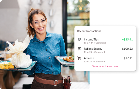 young female restaurant server smiling carrying plates