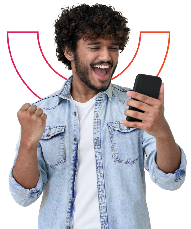 man cheering looking at his phone